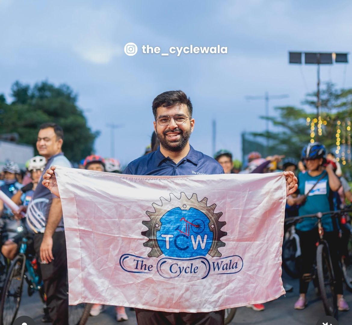 owner of our cycle shop, The Cycle Wala waving off the flag of our brand with pride and grace.